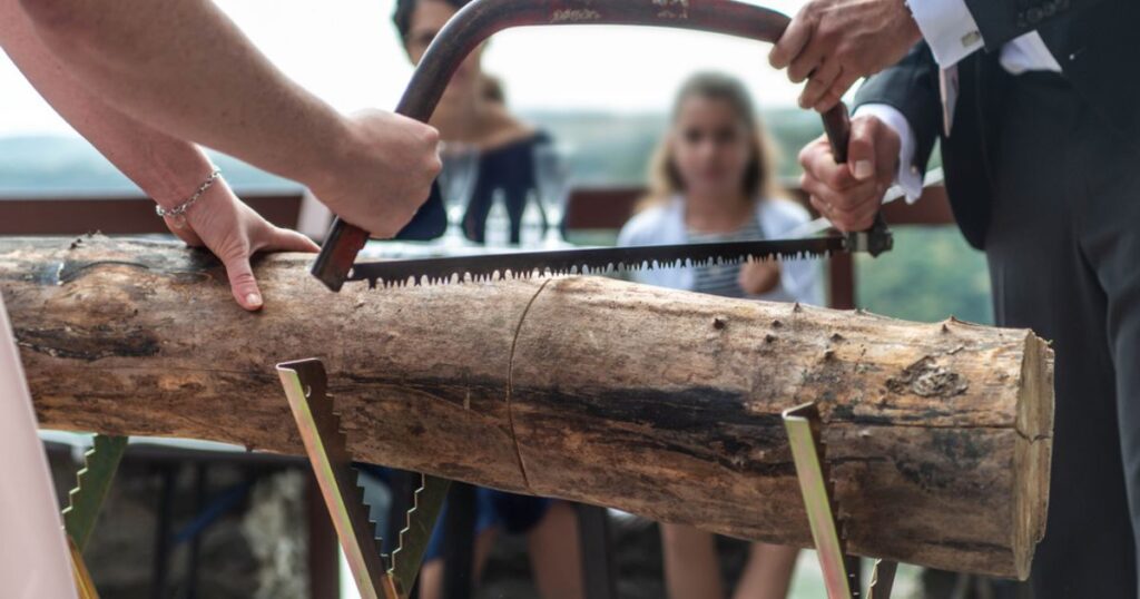 Swiss wedding tradition breaking a log